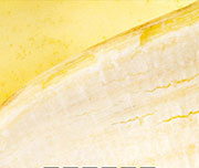 Zoomed In A yellow fruit peeled. Banana