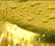 Zoomed In A gold object with water on itBottlecap 