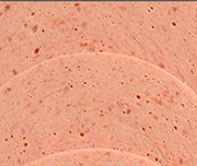 Zoomed In Sliced pieces of meat layerd on top of one another Bologna 