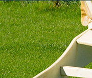Zoomed In Green grass and a white object on it Lawnchair 