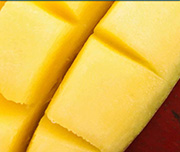 Zoomed In A cut up piece of yellow fruit Mango 