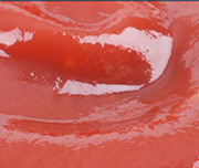 Zoomed In A red substance you put on food Ketchup