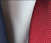 Zoomed In A person wearing a suit with a red tie Necktie 