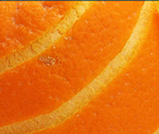 Zoomed In A bright fruit with the skin partially pealed off Orange 