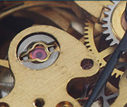 Zoomed In The gears inside of a time piece Watch 