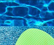 Zoomed In A green object by a pool Sandal 
